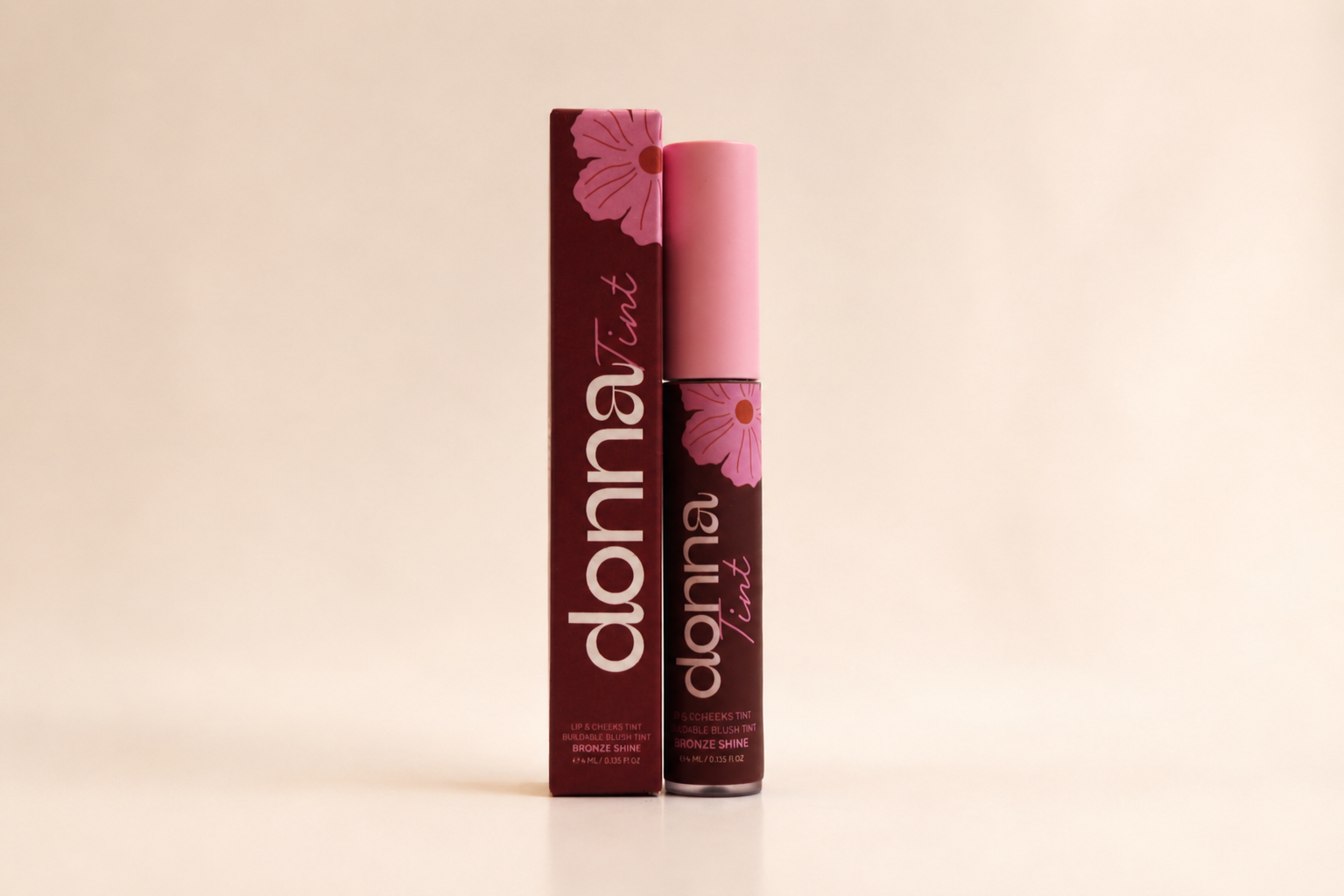Donna Bronze Shine Lip & Cheek Tint with its carton