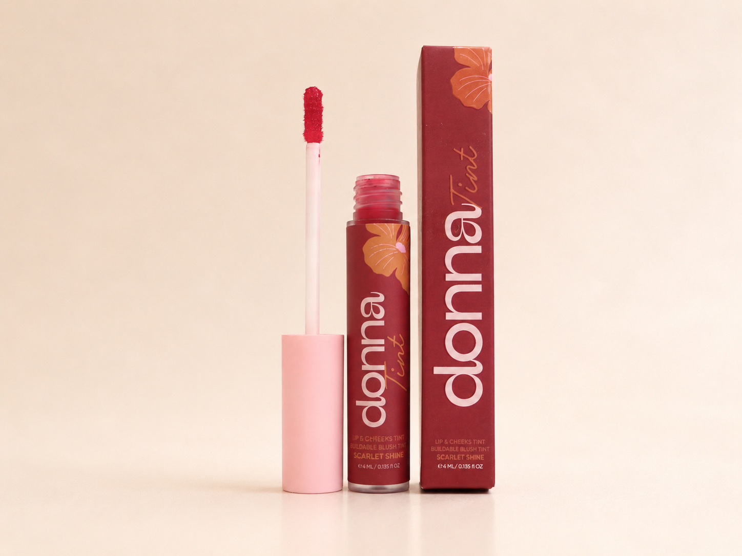 Donna Scarlet Shine Lip & Cheek Tint with its applicator and carton